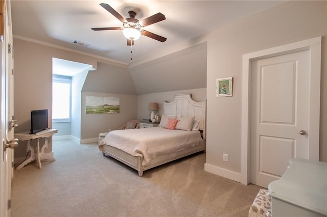 bedroom with lofted ceiling, crown molding, light colored carpet, and ceiling fan