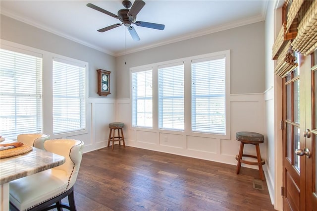 sitting room featuring ornamental molding, plenty of natural light, dark wood-type flooring, and ceiling fan