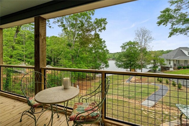 balcony featuring a water view