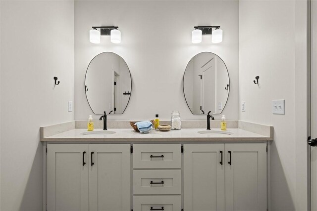 full bath featuring double vanity and a sink
