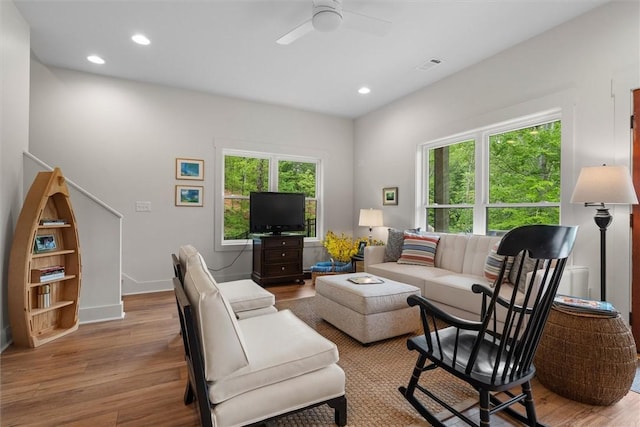 living area with visible vents, recessed lighting, ceiling fan, and wood finished floors