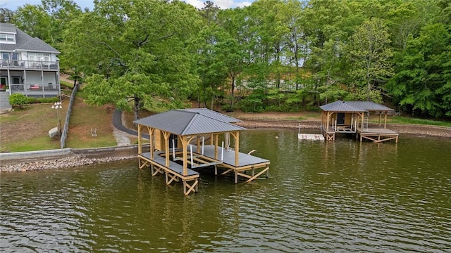 view of dock featuring boat lift and a water view