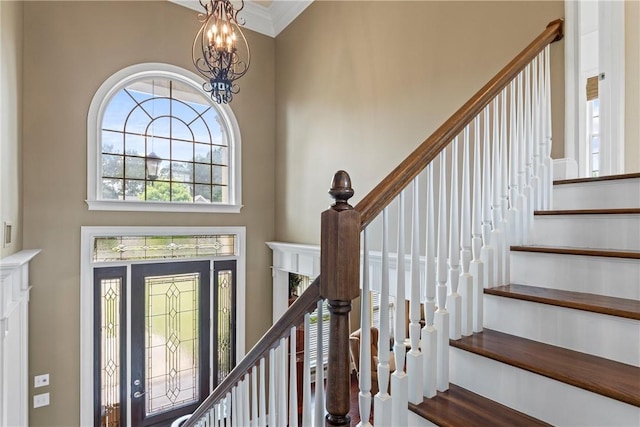 2182 Conservation Dr, Auburn, AL 36879 - foyer entrance with a high ceiling, a chandelier, stairs, and ornamental molding