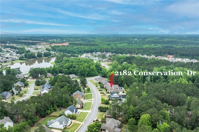 2182 Conservation Dr, Auburn, AL 36879 - view of property location with a heavily wooded area, a nearby body of water, and nearby suburban area