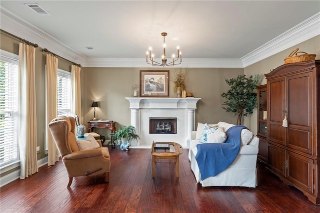 2182 Conservation Dr, Auburn, AL 36879 - sitting room featuring a chandelier, dark wood-type flooring, ornamental molding, a fireplace, and baseboards
