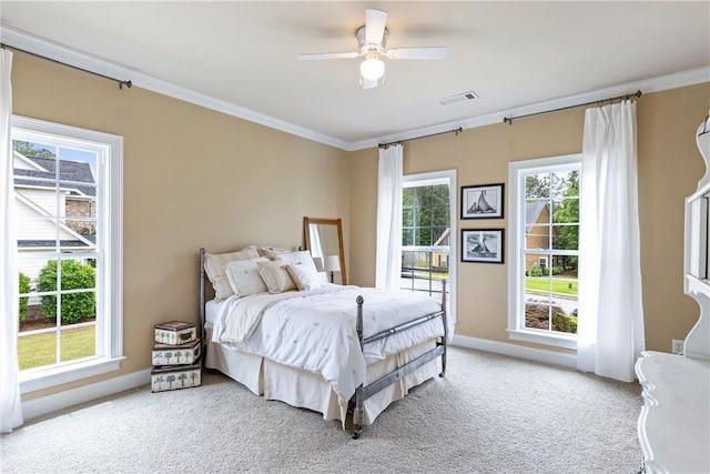 2182 Conservation Dr, Auburn, AL 36879 - bedroom with ornamental molding, light colored carpet, baseboards, and a ceiling fan