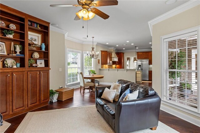 2182 Conservation Dr, Auburn, AL 36879 - living room featuring ornamental molding, ceiling fan, dark wood-style floors, recessed lighting, and a chandelier