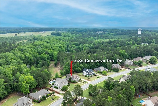 2182 Conservation Dr, Auburn, AL 36879 - aerial view of residential area featuring a heavily wooded area
