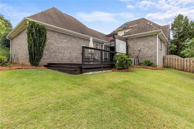 2182 Conservation Dr, Auburn, AL 36879 - back of house featuring brick siding, a wooden deck, and roof with shingles