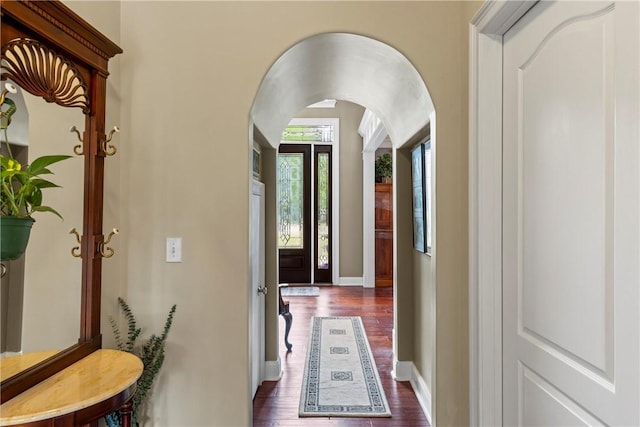 2182 Conservation Dr, Auburn, AL 36879 - corridor featuring arched walkways, dark wood-style floors, and baseboards
