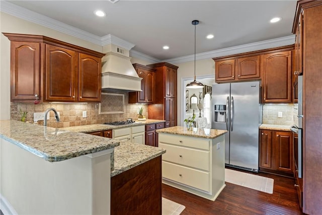 2182 Conservation Dr, Auburn, AL 36879 - kitchen with stainless steel appliances, a peninsula, premium range hood, dark wood-style floors, and backsplash