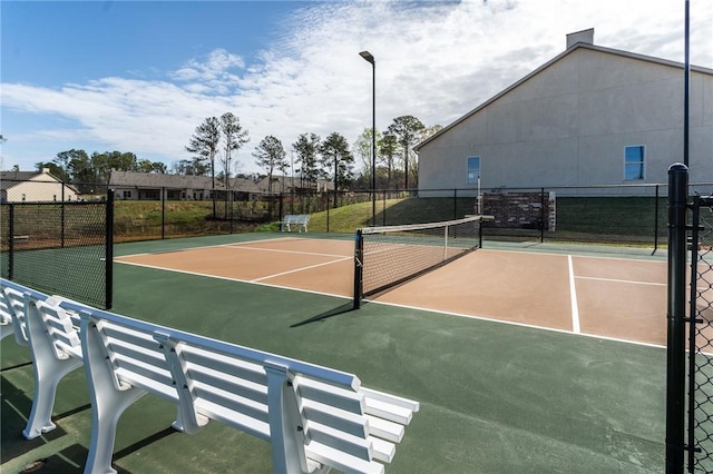 view of sport court featuring community basketball court and fence