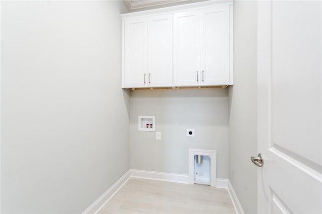 clothes washing area with baseboards, hookup for a washing machine, cabinet space, and hookup for an electric dryer
