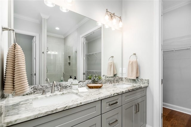 bathroom with ornamental molding and a sink