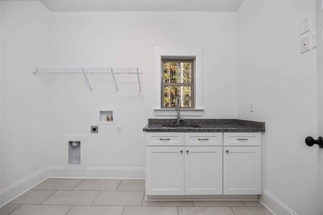 laundry area featuring sink, cabinets, light tile patterned floors, hookup for a washing machine, and electric dryer hookup
