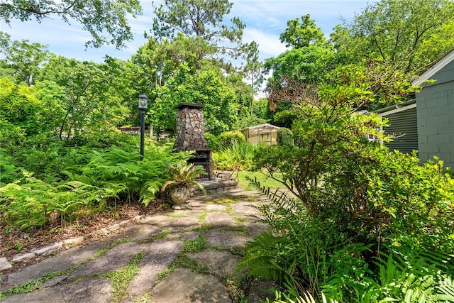 335 Woodfield Dr, Auburn, AL 36830 - view of yard featuring exterior fireplace