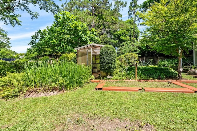 335 Woodfield Dr, Auburn, AL 36830 - view of green lawn with an exterior structure and an outbuilding