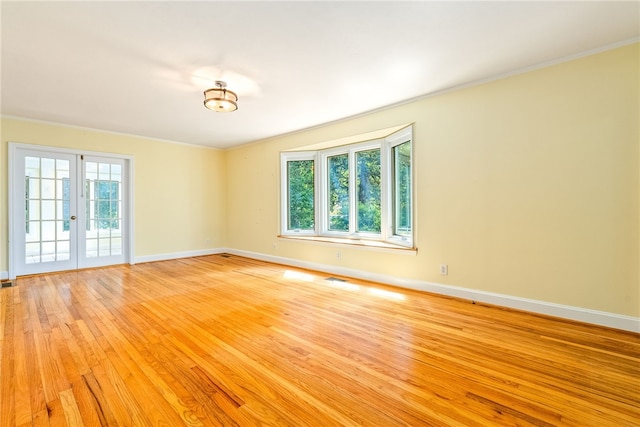 335 Woodfield Dr, Auburn, AL 36830 - empty room featuring light wood-style flooring, crown molding, and french doors