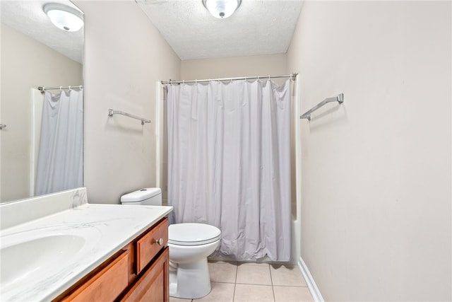 4339 Live Oak Dr, Auburn, AL 36830 - bathroom with vanity, a textured ceiling, toilet, tile patterned flooring, and shower / tub combo with curtain