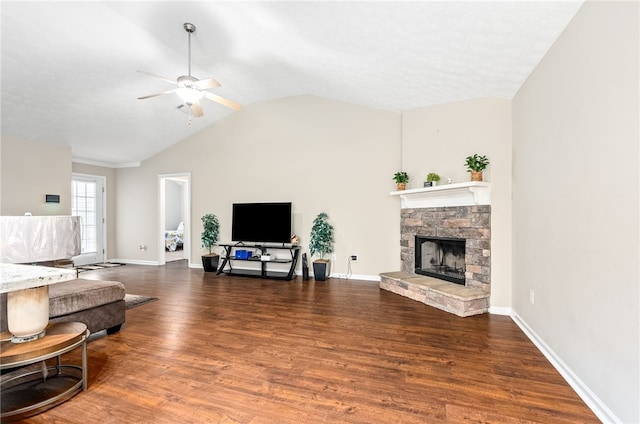4339 Live Oak Dr, Auburn, AL 36830 - living area featuring ceiling fan, lofted ceiling, wood finished floors, a stone fireplace, and baseboards