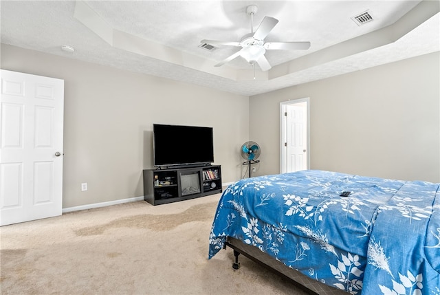 4339 Live Oak Dr, Auburn, AL 36830 - carpeted bedroom with a raised ceiling, baseboards, and a ceiling fan