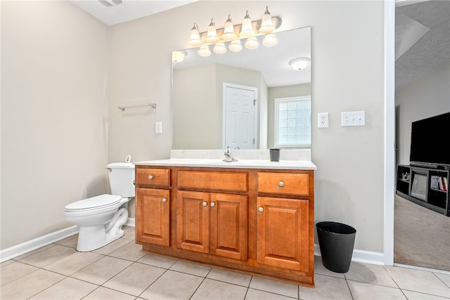 4339 Live Oak Dr, Auburn, AL 36830 - bathroom with vanity, tile patterned flooring, toilet, and baseboards