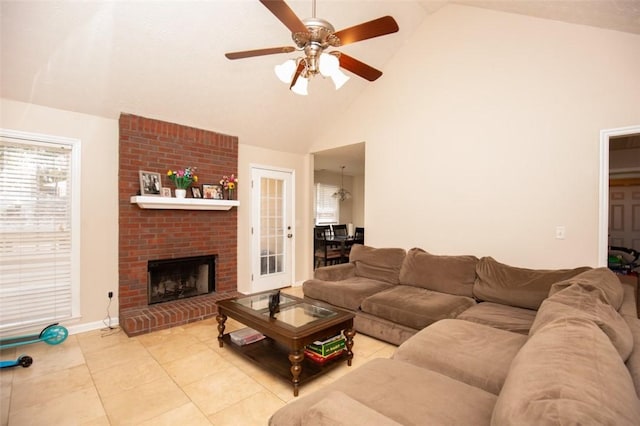 living room with light tile patterned floors, high vaulted ceiling, ceiling fan, and a fireplace