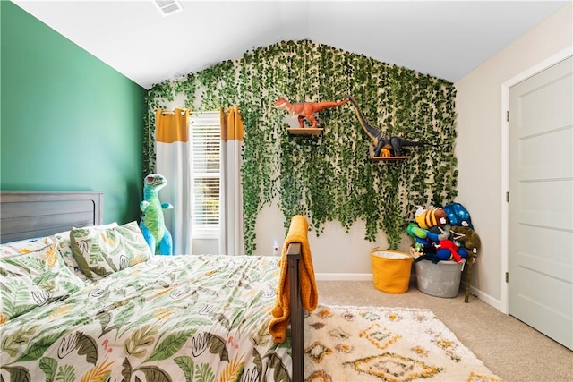 carpeted bedroom with vaulted ceiling