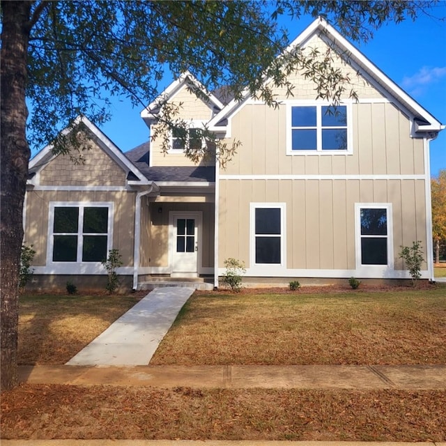 craftsman house with a front lawn