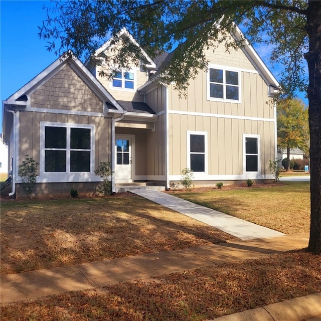 craftsman-style house featuring a front lawn