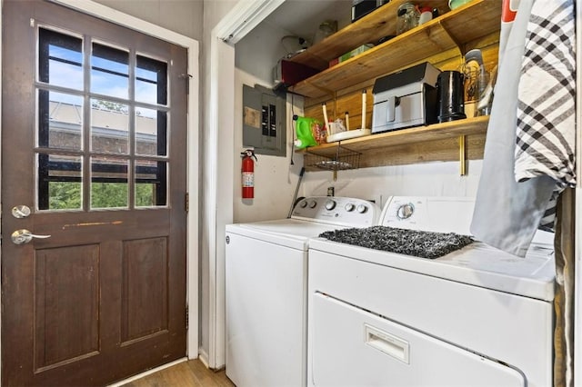 1066 Brown St, Valley, AL 36854 - laundry area with electric panel, washing machine and dryer, and light wood-style floors