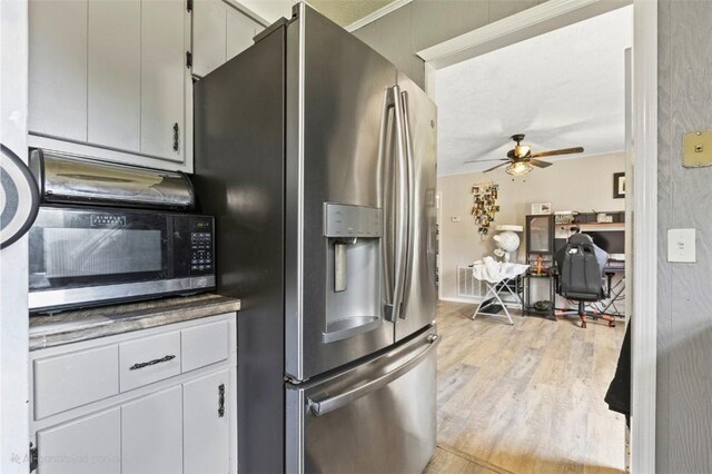 1066 Brown St, Valley, AL 36854 - kitchen with stainless steel fridge with ice dispenser, a ceiling fan, and light wood-type flooring