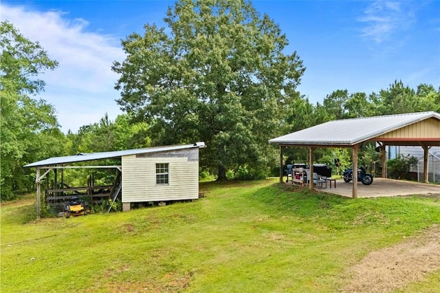 1066 Brown St, Valley, AL 36854 - view of green lawn with a carport