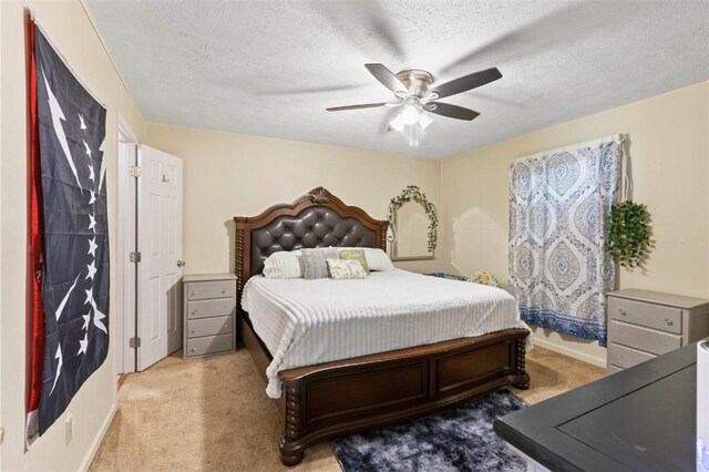 1066 Brown St, Valley, AL 36854 - carpeted bedroom with ceiling fan and a textured ceiling