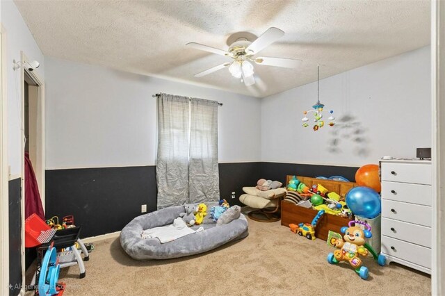 1066 Brown St, Valley, AL 36854 - game room with carpet, ceiling fan, and a textured ceiling
