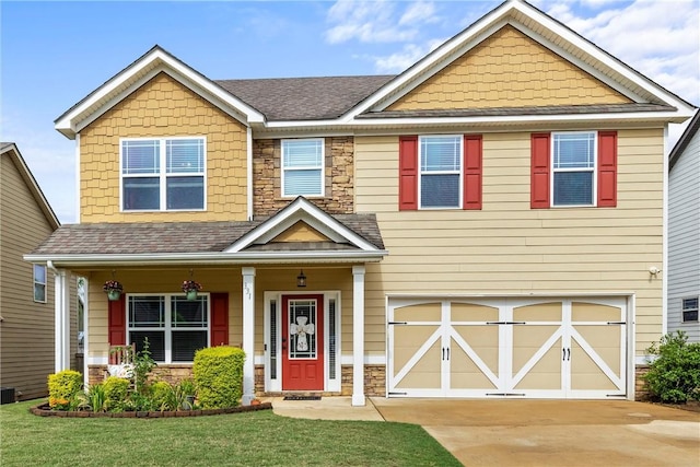 331 Lightness Dr, Auburn, AL 36830 - craftsman house featuring an attached garage, a front yard, stone siding, and concrete driveway