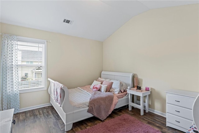 331 Lightness Dr, Auburn, AL 36830 - bedroom with lofted ceiling, wood finished floors, and baseboards
