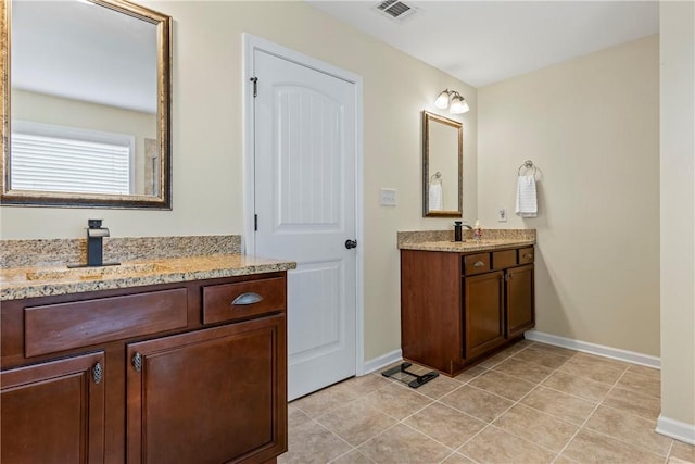 331 Lightness Dr, Auburn, AL 36830 - full bath featuring baseboards, two vanities, and tile patterned floors