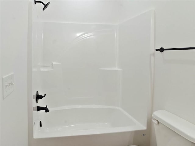 bathroom with toilet and shower / washtub combination