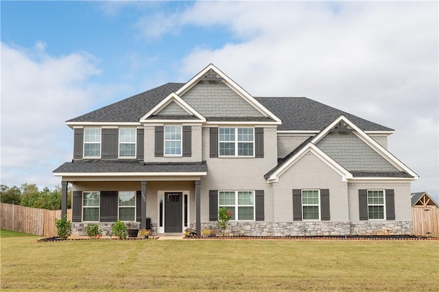 craftsman-style home featuring a front lawn