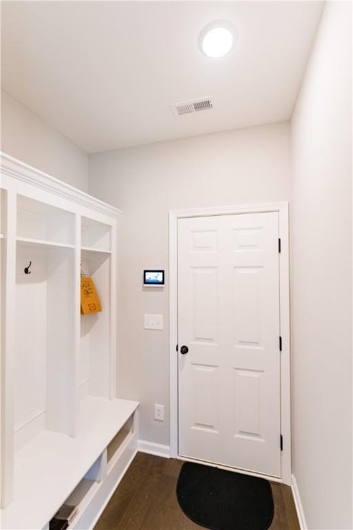 mudroom with dark wood-type flooring