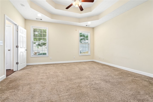 1317 Tulip Ct, Auburn, AL 36830 - unfurnished bedroom featuring carpet flooring, multiple windows, a tray ceiling, recessed lighting, and ceiling fan