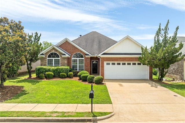 1317 Tulip Ct, Auburn, AL 36830 - view of front facade with a garage, a front yard, concrete driveway, brick siding, and board and batten siding