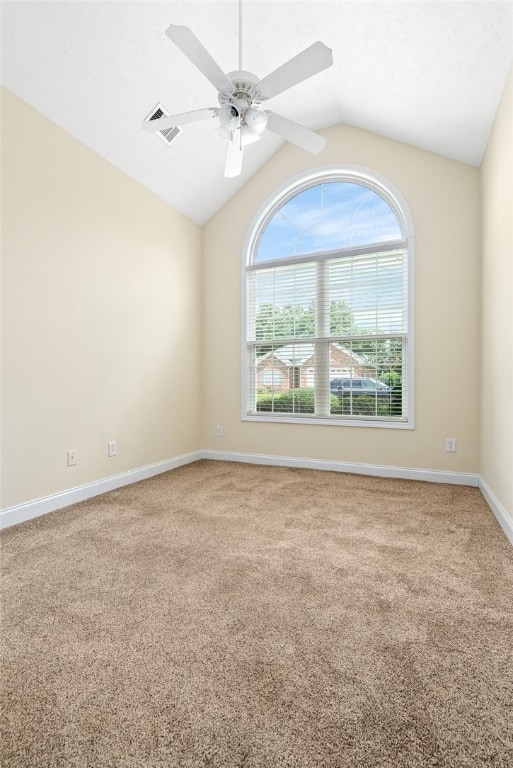 1317 Tulip Ct, Auburn, AL 36830 - empty room featuring carpet flooring, vaulted ceiling, and a ceiling fan