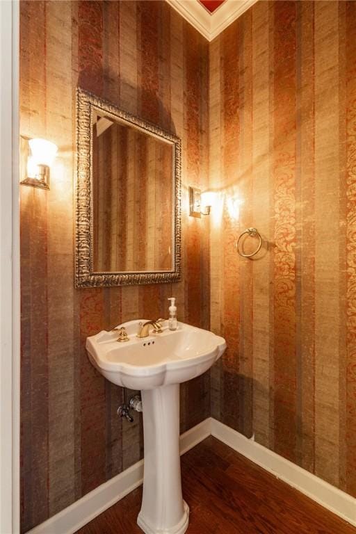 56 Peachwood Dr, Tallassee, AL 36078 - bathroom with wood finished floors, crown molding, and baseboards