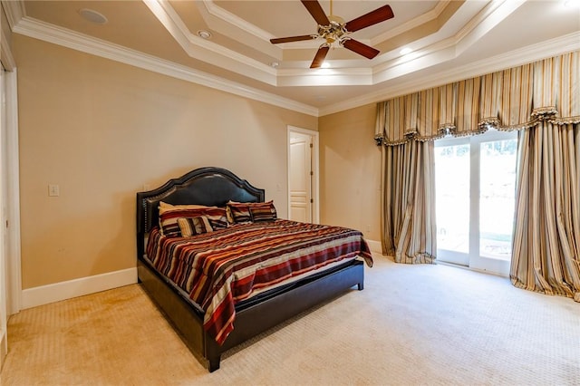 56 Peachwood Dr, Tallassee, AL 36078 - bedroom featuring light carpet, ornamental molding, access to outside, a tray ceiling, and baseboards