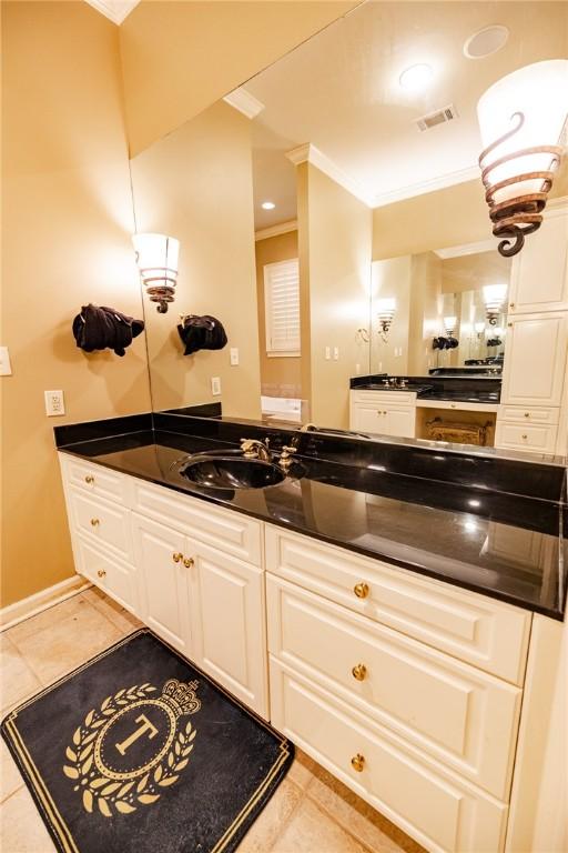 56 Peachwood Dr, Tallassee, AL 36078 - bathroom with ornamental molding, tile patterned flooring, and vanity