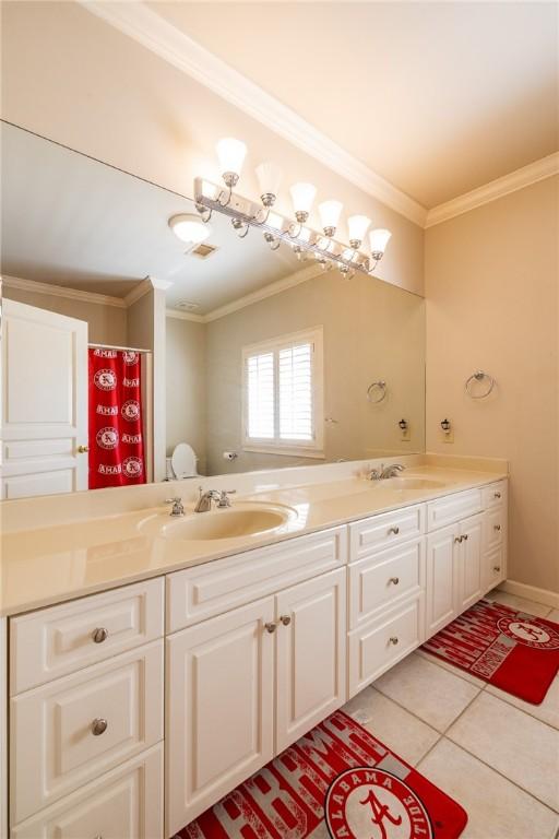 56 Peachwood Dr, Tallassee, AL 36078 - bathroom with double vanity, crown molding, and tile patterned flooring