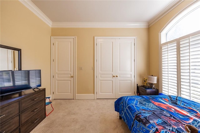 56 Peachwood Dr, Tallassee, AL 36078 - bedroom featuring ornamental molding, light carpet, a closet, and baseboards