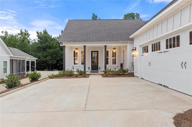 view of front of home with covered porch and a garage